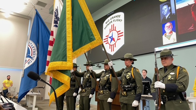 Military members honoring our flags at Honor Flight Reunion attendees at Burrell College in New Mexico