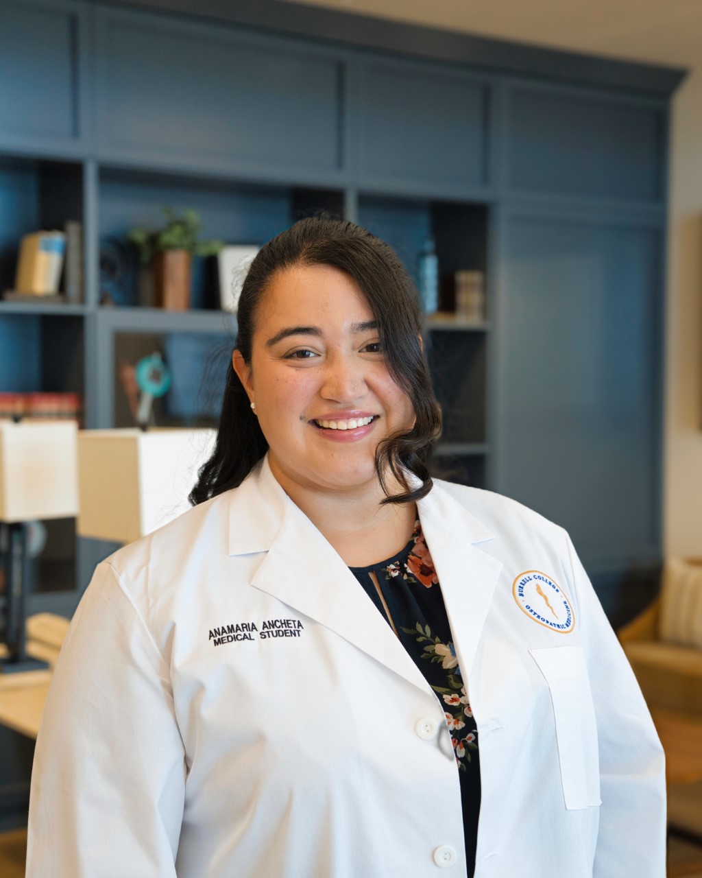 Student physician Anamaria Ancheta from Burrell College smiles after receiving the AAFP “Be Their First” Scholarship and research poster invitation.