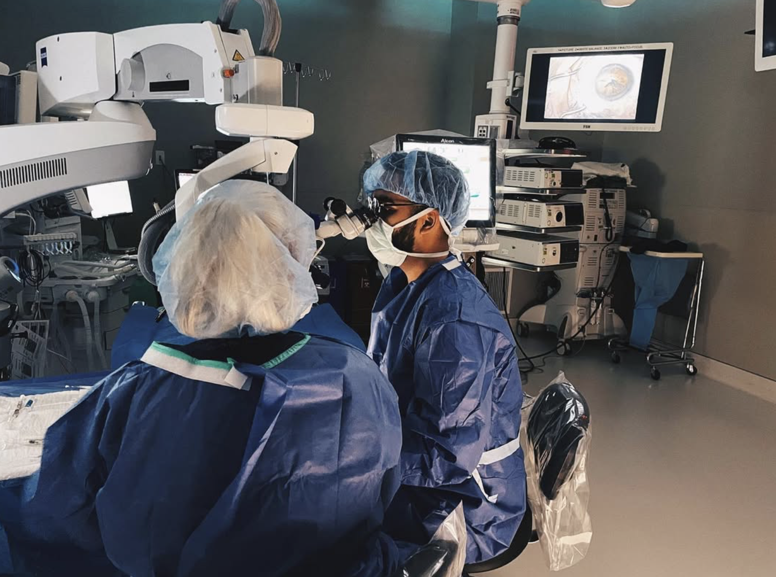 alumnus Harris Ahmed, DO, MPH and another Doctor work in a hospital surgery room